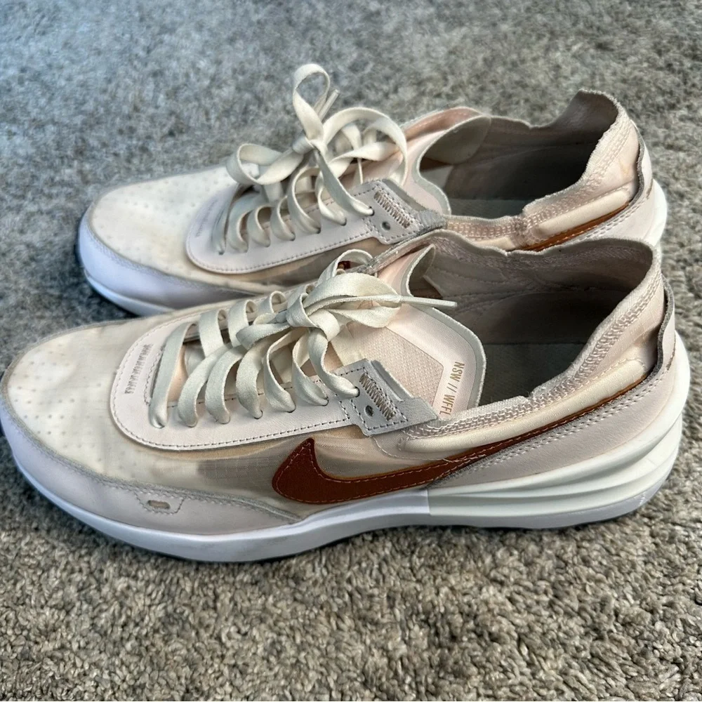Nike Women's Sneakers in White with Metallic Rose Gold Swoosh